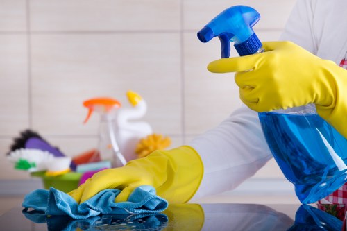 Carpet cleaning technician preparing equipment with safety precautions