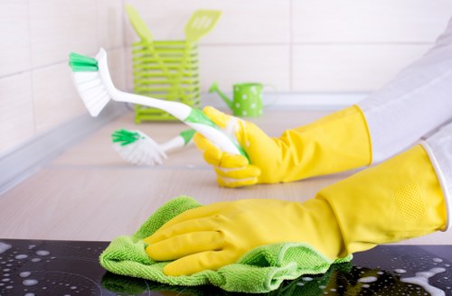 Team member managing a safe carpet cleaning workspace with warning signs